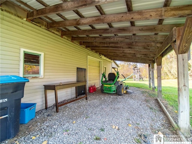 view of patio / terrace with an attached carport and a playground