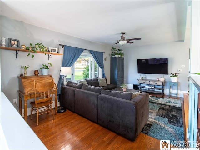 living room with hardwood / wood-style flooring and ceiling fan