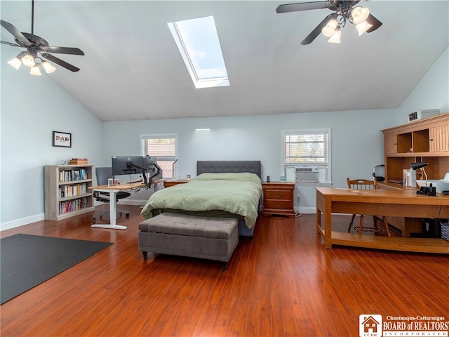 bedroom with ceiling fan, dark hardwood / wood-style flooring, and lofted ceiling with skylight