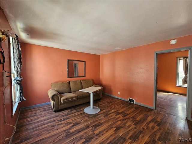 living room featuring dark hardwood / wood-style flooring