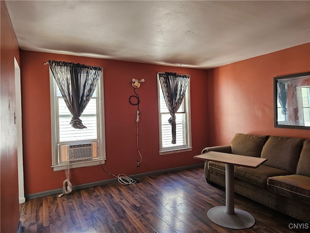 living room with cooling unit and dark hardwood / wood-style flooring