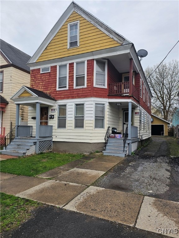 view of front of house featuring a porch and a balcony