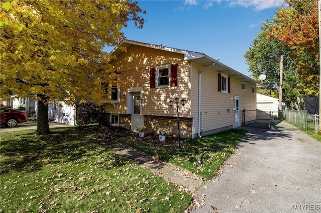 view of property exterior with a yard