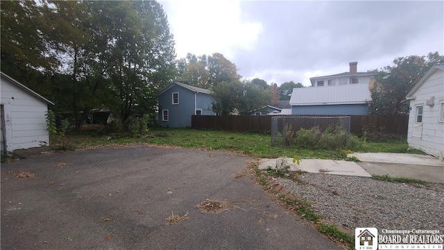 view of yard with a balcony