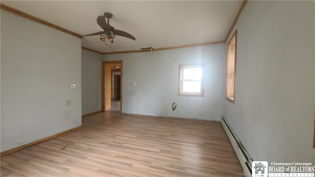 empty room featuring light hardwood / wood-style floors, ornamental molding, baseboard heating, and ceiling fan