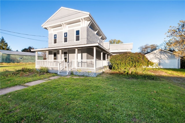 view of front facade with a front yard and covered porch