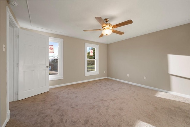 empty room with carpet floors and ceiling fan