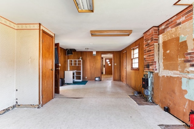 corridor with brick wall and wooden walls