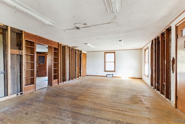 unfurnished room with hardwood / wood-style floors