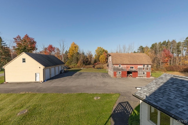 exterior space featuring an outdoor structure and a garage