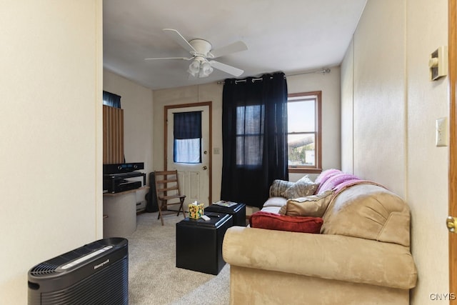 carpeted living room featuring ceiling fan