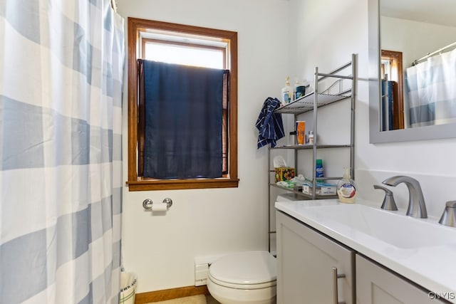 bathroom featuring vanity and toilet