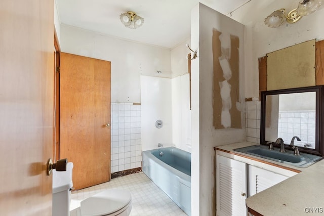 bathroom with a tub to relax in, tile walls, vanity, and toilet