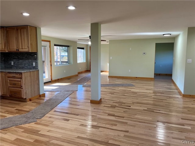 interior space featuring light hardwood / wood-style flooring and ceiling fan