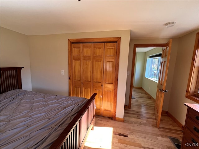 bedroom featuring a closet and light hardwood / wood-style floors