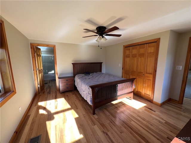 unfurnished bedroom featuring a closet, ceiling fan, and light wood-type flooring