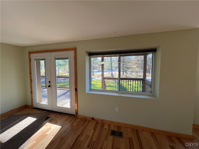 entryway featuring french doors and hardwood / wood-style floors