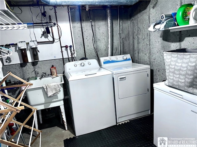 laundry room with washing machine and clothes dryer