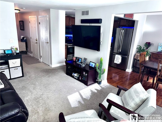 living room with light hardwood / wood-style flooring