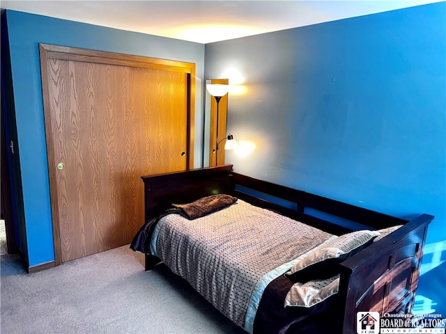 bedroom featuring a closet and carpet floors