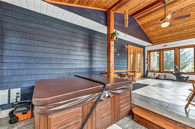 interior space featuring wood ceiling, hardwood / wood-style floors, wooden walls, and french doors