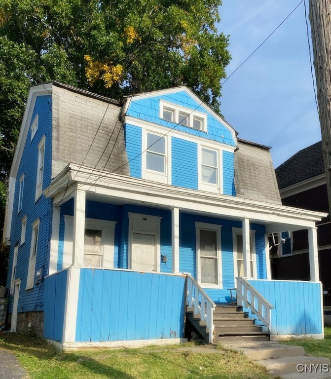 view of front of home featuring covered porch