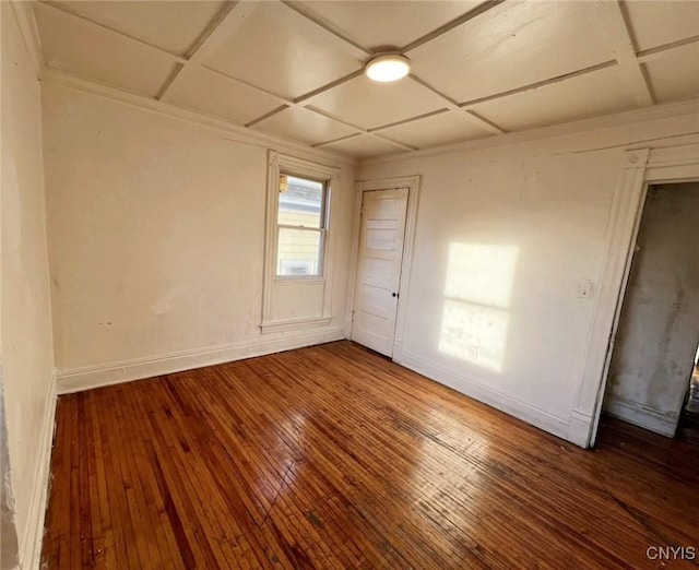 unfurnished room featuring hardwood / wood-style floors and coffered ceiling