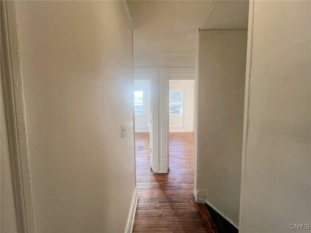 corridor featuring dark hardwood / wood-style floors