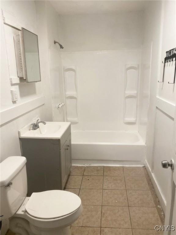 full bathroom featuring tile patterned floors, vanity, toilet, and bathtub / shower combination