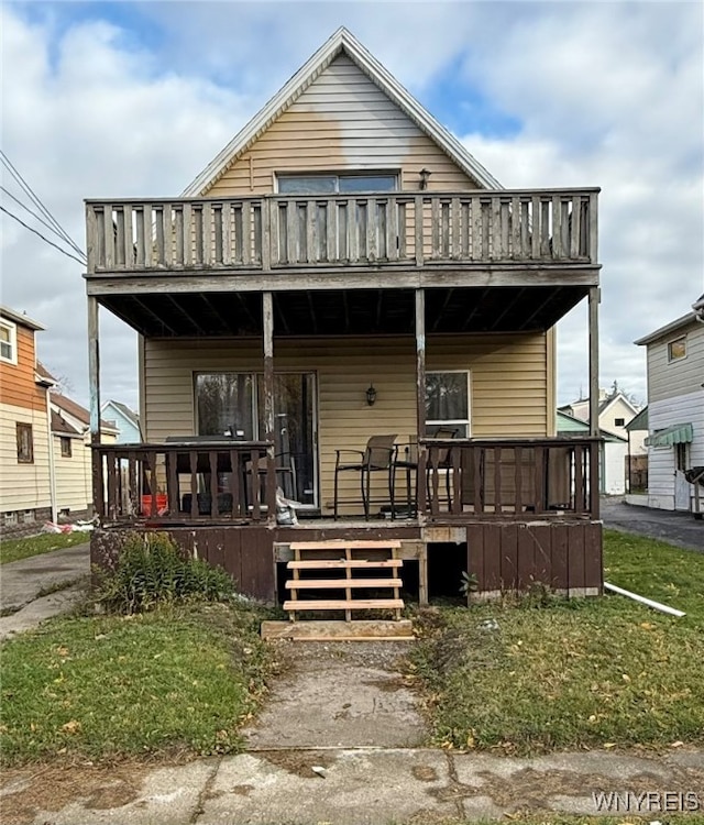 view of front of property with a wooden deck