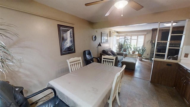 dining space featuring light hardwood / wood-style flooring and ceiling fan