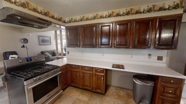 kitchen featuring extractor fan, stainless steel gas stove, and kitchen peninsula