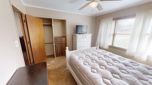 bedroom featuring a closet, ornamental molding, light parquet floors, and ceiling fan