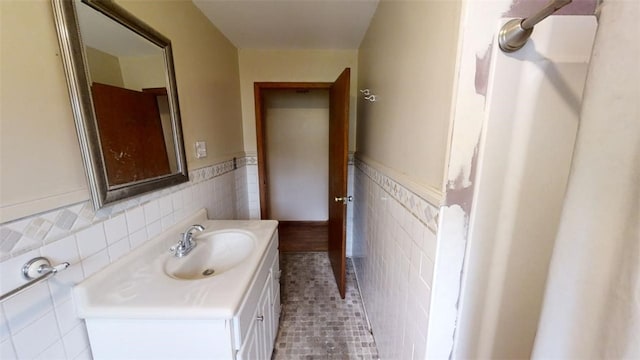 bathroom featuring tile walls, vanity, and tile patterned floors