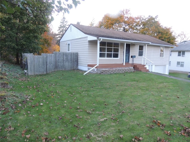 view of front of property with a garage and a front yard