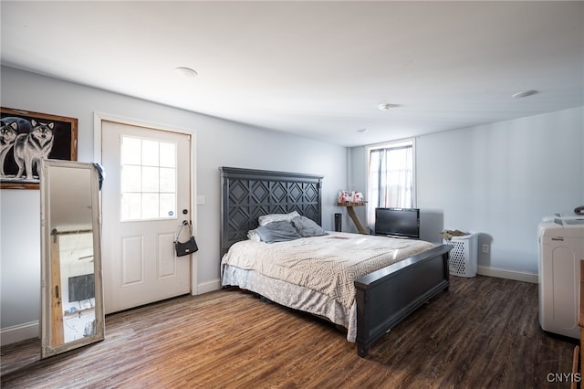 bedroom featuring multiple windows and dark wood-type flooring