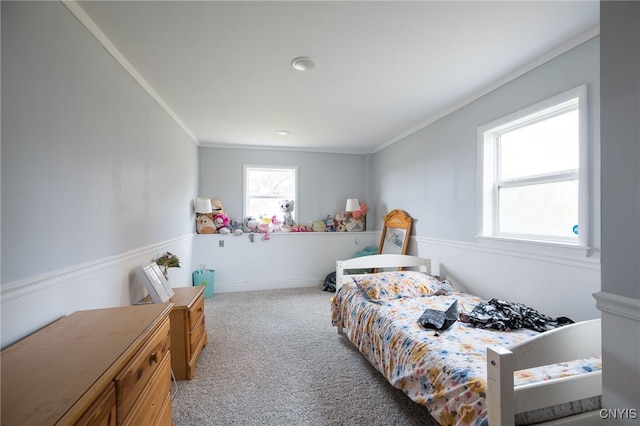 carpeted bedroom featuring crown molding