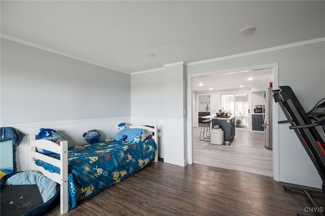 bedroom with crown molding, stainless steel refrigerator, and dark hardwood / wood-style flooring