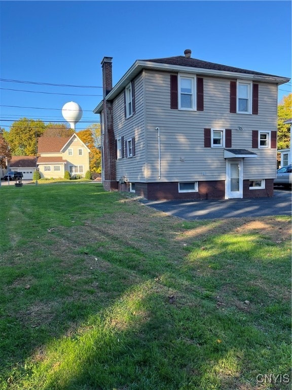 back of property with a yard