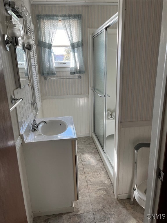 bathroom with vanity and an enclosed shower