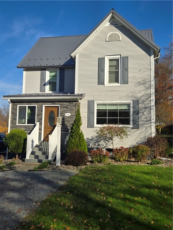 view of property featuring a front yard