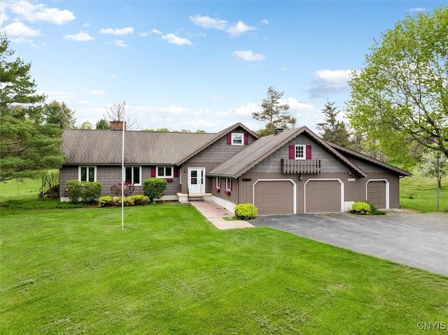 view of front of house featuring a garage and a front yard