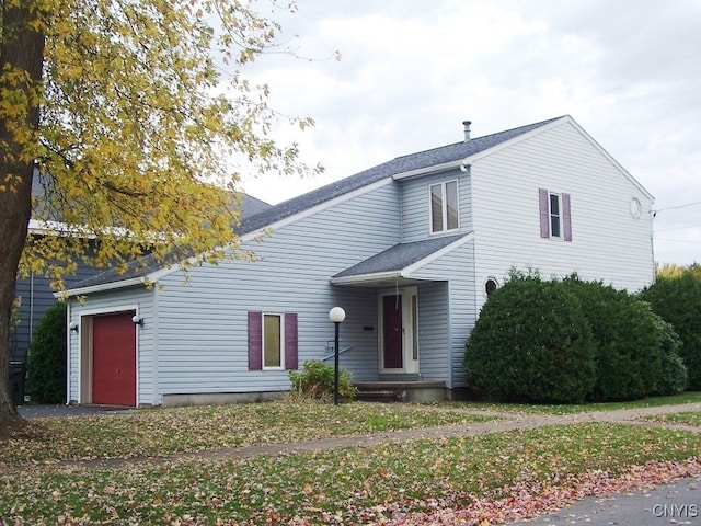 front of property featuring a garage