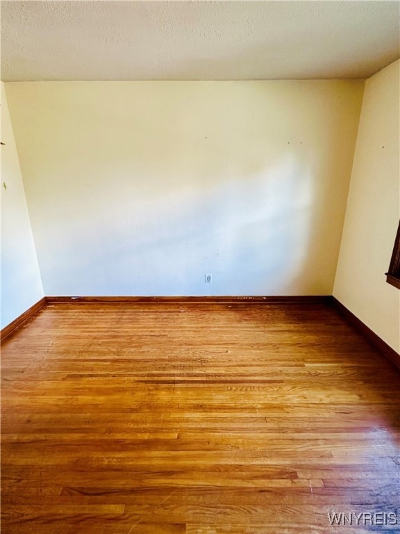 unfurnished room featuring light hardwood / wood-style flooring