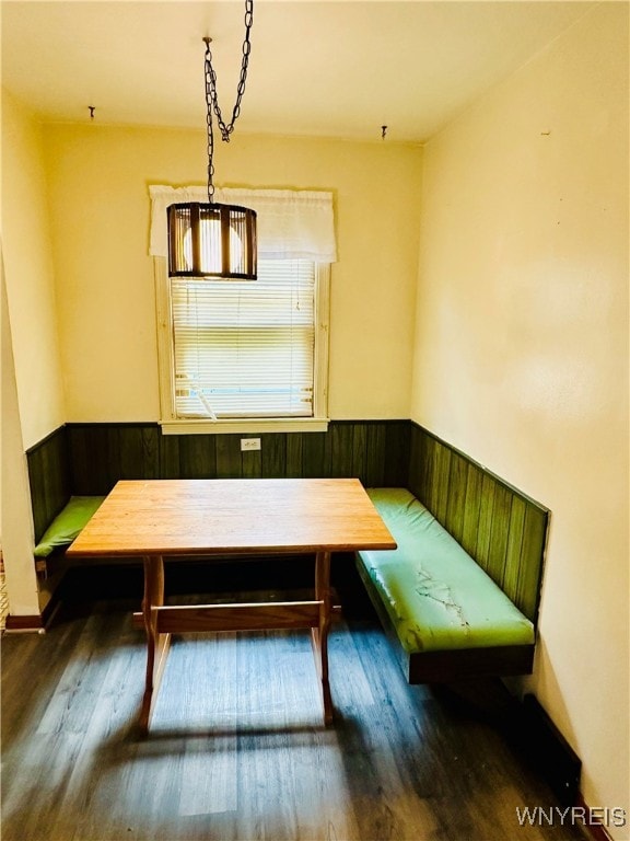 unfurnished dining area with breakfast area and dark hardwood / wood-style floors