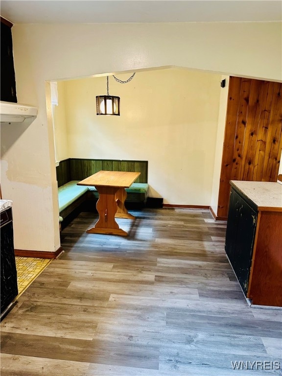 dining area featuring breakfast area and hardwood / wood-style flooring