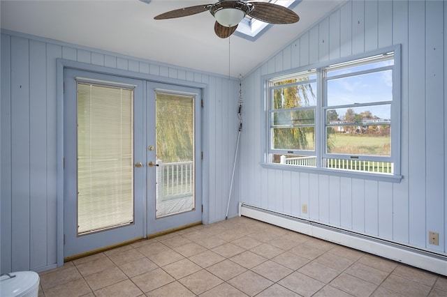 entryway featuring french doors, a baseboard heating unit, light tile patterned flooring, and ceiling fan