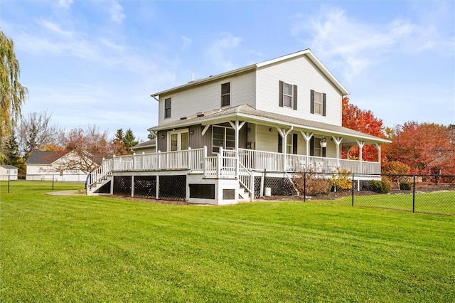 rear view of house with a lawn