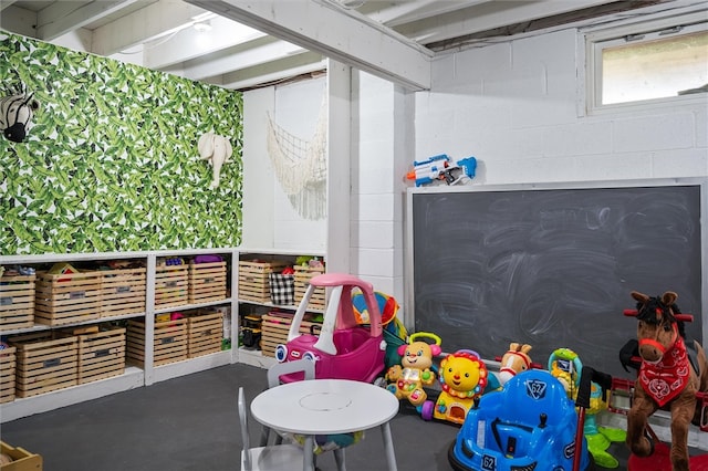 game room with concrete floors