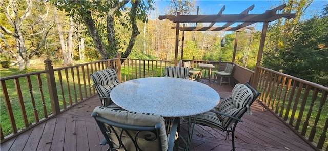 wooden terrace with a lawn